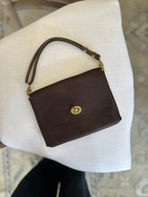Load image into Gallery viewer, Mini Clutch with Twist Lock in Chocolate Milled Vegetable Tanned Leather with Shortie leather handle
