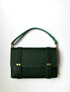 A beautiful milled Italian vegetable tanned leather handbag with a short handle.  A crossbody chain can be added. 