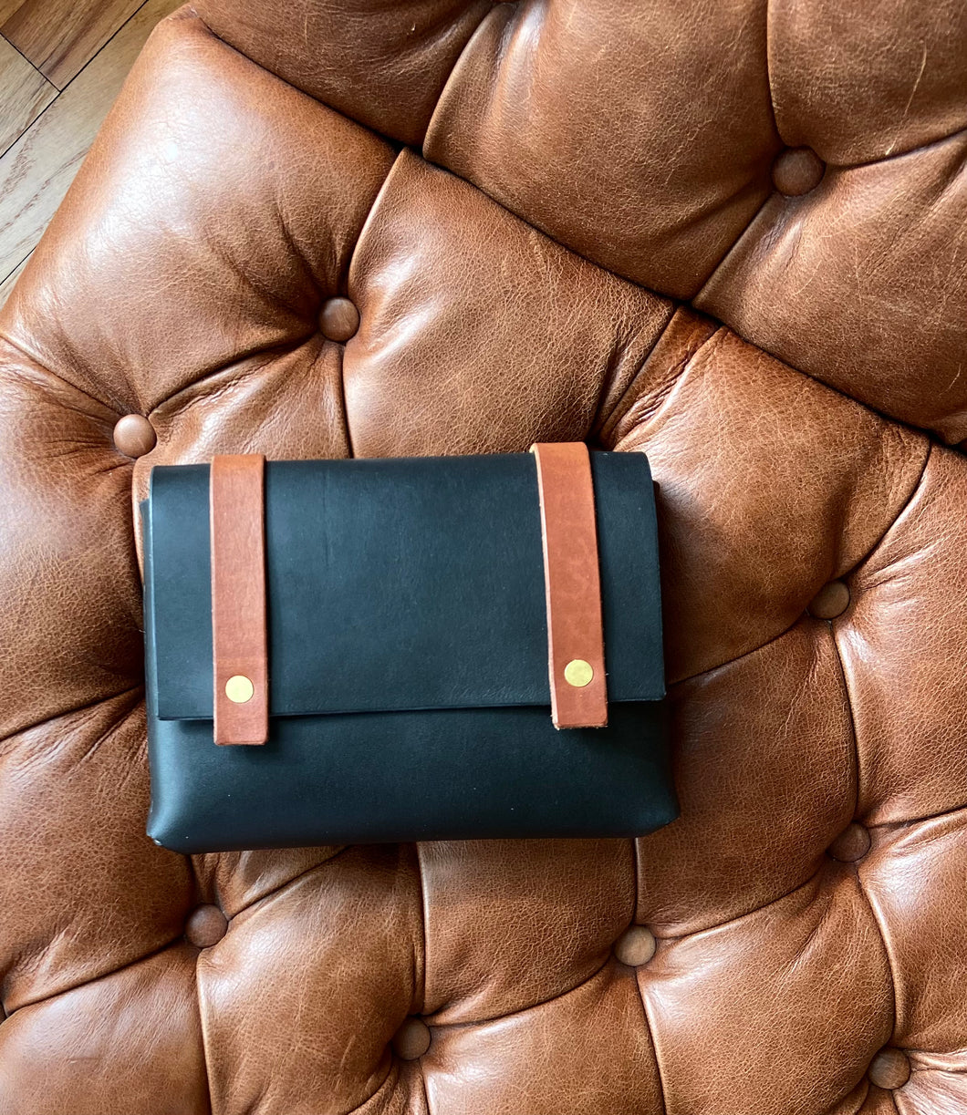 Mini Clutch in Black Vegetable Tanned Leather with Cognac Straps