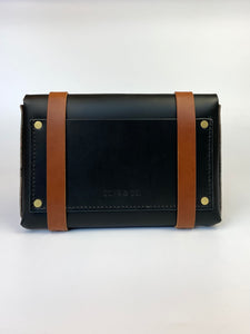 Medium Clutch in Black Vegetable Tanned Leather with Cognac Straps